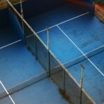 a tennis court with a blue tennis court