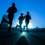 silhouette of three women running on grey concrete road, iscrizioni Milanosport 2025/26