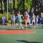 a group of young men playing a game of basketball migliori squadre basket amatoriali Milano