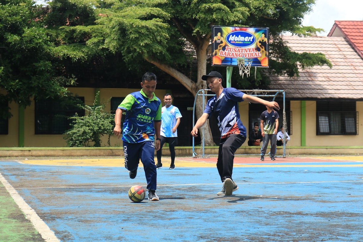 A group of young men playing a game of soccer