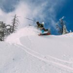 person skiing on snow-covered hill Sci di fondo nei boschi vicino Milano