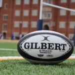 a close up of a rugby ball on a field praticare rugby a Milano