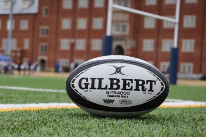 a close up of a rugby ball on a field praticare rugby a Milano
