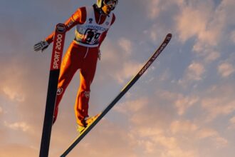 a man flying through the air while riding skis