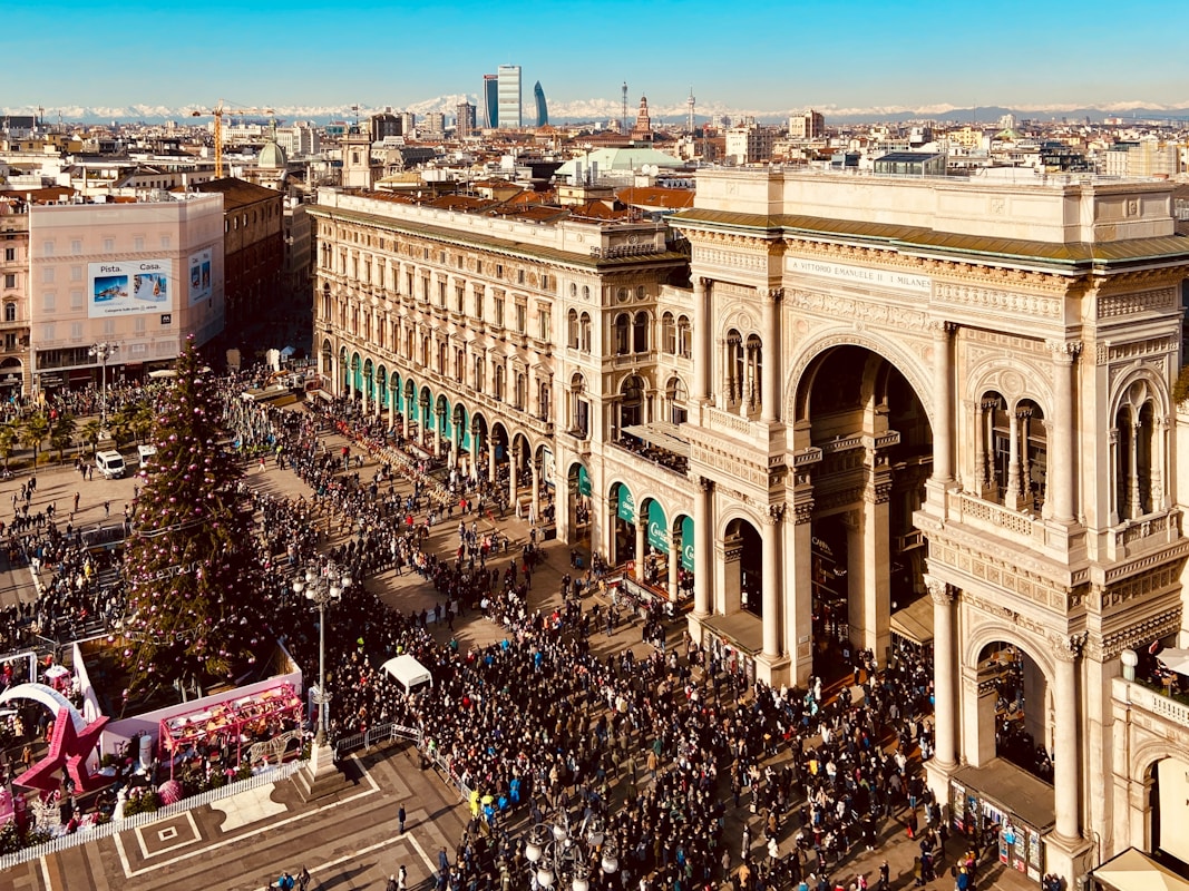 a large crowd of people standing in front of a building