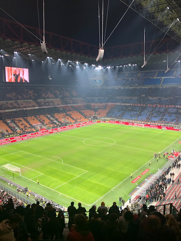 people watching football game on stadium