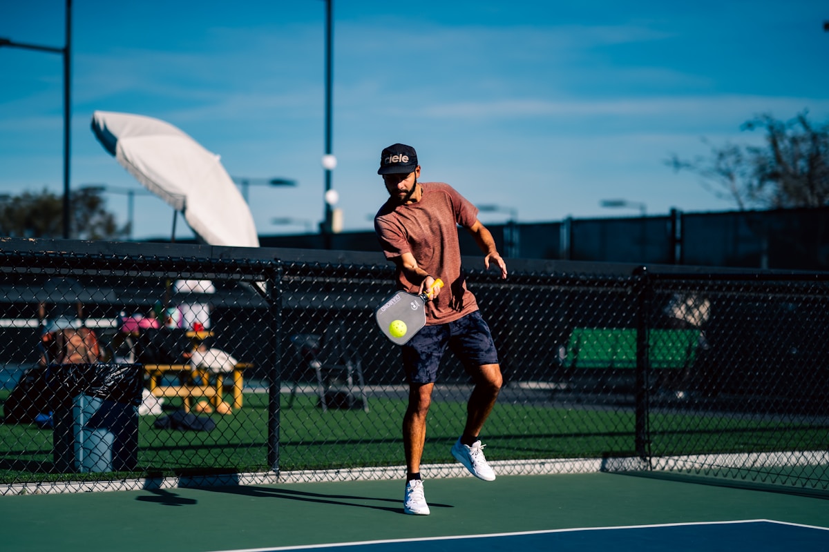 A man on a tennis court holding a tennis racket
